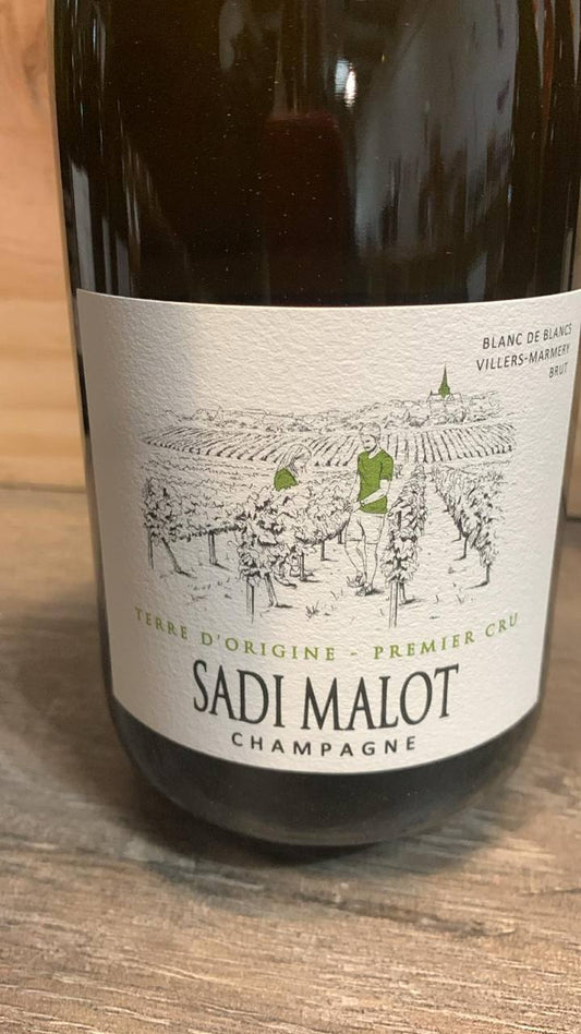 Front- und Rücketikett Champagne Sadi Malot Terre d’Origine Premier Cru aus Villers-Marmery mit Angaben zu Chardonnay, Dosage, Alkoholgehalt und Sulfiten