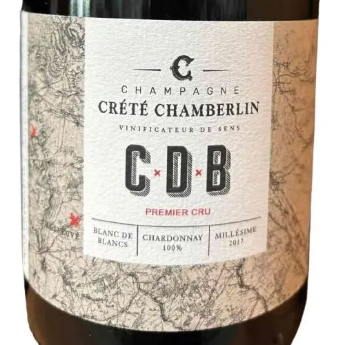 Flasche des Champagne Crété Chamberlin 2017 Premier Cru, Blanc de Blancs mit brioche-infusierten Aromen und Zitrusnoten.