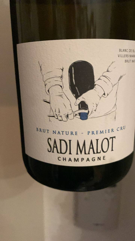 Front- und Rücketikett Champagne Sadi Malot Brut Nature Premier Cru aus Villers-Marmery mit Angaben zu Chardonnay, Dosage und Degorgement